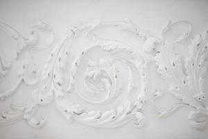 White swirling plaster pattern. Organic plaster patterns. Vintage white ceiling photo