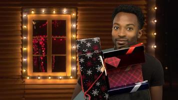 man holding christmas gifts many boxes stack outside illuminated house windows lights decorations holiday abundance photo