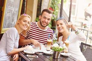 Group of tourists in the cafe photo