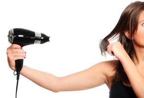 Woman and a hair dryer photo