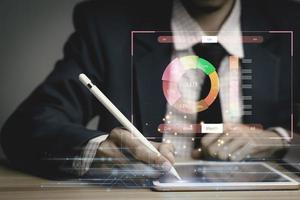 businessman working with business Analytics and Data Management System on tablet, online document management and metrics connected to database. Corporate strategy for finance, operations, sales. photo