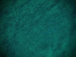 Dark green old velvet fabric texture used as background. Empty green fabric background of soft and smooth textile material. There is space for text... photo