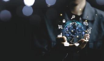 Businessman holding a virtual screen world with virtual Global Internet connection. Digital marketing and global internet connection application technology, Digital link tech,Financial daily life. photo
