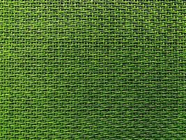 Close up green The  is woven into a net. natura rope texture as a background. Full frame of tightly woven rope pattern.with space for text, for a background. photo