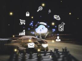 Businessman holding smartphone with virtual Global Internet connection.Digital marketing and global internet connection application technology, Digital link tech,Financial daily life.idea light bulb. photo