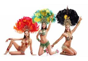 Brazilian women dancing samba over white background photo