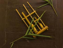 Angklung, the traditional sundanese musical instrument made from bamboo. Isolated on white background photo