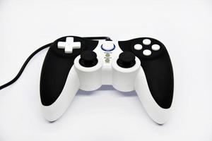 The gamepad is black and white on a white background. Game joystick close-up. A gamepad for a game console. photo