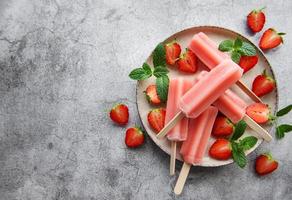 Strawberry ice cream popsicles photo