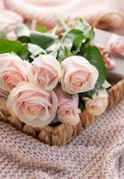 Tray with  bouquet of beautiful pink roses and gift box on  bed. photo