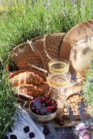 Summer picnic on a lavender field photo