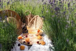 Summer picnic on a lavender field photo