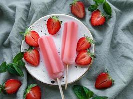Strawberry ice cream popsicles photo