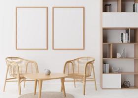 Two empty vertical picture frames on white wall in modern living room. Mock up interior in scandinavian, boho style. Free space for picture, poster. Rattan armchairs, table, shelves. 3D rendering. photo