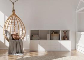 Empty white wall in modern child room. Mock up interior in scandinavian, boho style. Free, copy space for your picture, poster. Console, rattan hanging armchair, toys. Cozy room for kids. 3D rendering photo