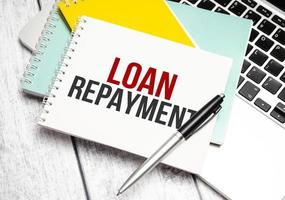 loan repayment . Conceptual background with chart ,papers and pen photo