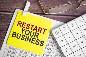 restart your business Text on business paper on office table photo