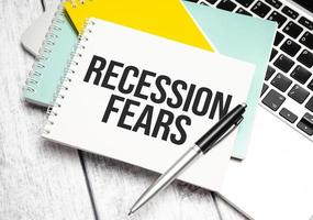 Recession fears . Conceptual background with chart ,papers and pen photo