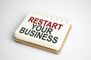 restart your business Text on business paper on office table photo