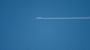 Widebody airplane flying at high altitude with contrail video