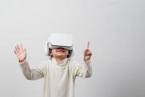 Asian little girl with virtual reality headset. Innovation technology and education concept photo