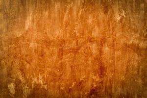 Cement wall texture background - old cement concrete wall with red warm light filter photo