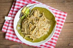 Bamboo shoots for food, Sliced and cooking bamboo shoots on banana leaf on the table food in Thailand photo