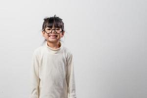 Asian little girl thinking something select focus shallow depth of field with copy space photo