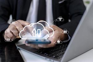 Cloud computing concept - connect to cloud. Businessman or information technologist click on cloud computing icon. photo