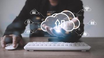 Man with cloud computing diagram show on hand. Cloud technology. Data storage. Networking and internet service concept. photo