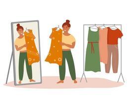 The girl chooses a dress from the wardrobe, looks at herself in the mirror. A set of clothes is hanging on a hanger. Vector graphics.