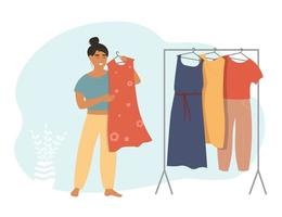 The girl chooses a dress from the wardrobe. A set of clothes is hanging on a hanger. Vector graphics.