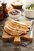 Sliced turkey on Thanksgiving or Christmas table photo