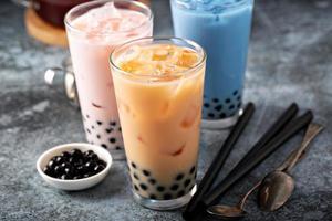 Variety of milk bubble tea in tall glasses photo