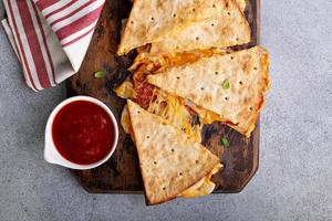 Pizza quesadilla with marinara sauce photo