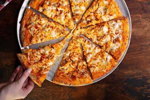 BBQ chicken pizza cut into slices photo