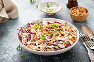 Asian cole slaw with peanuts and green onion photo