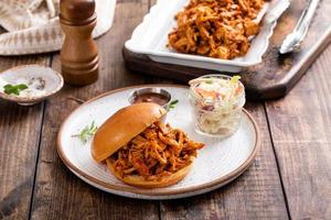 BBQ chicken sandwich on a brioche bun with coleslaw photo