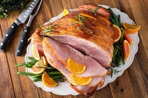 Christmas honey glazed ham served on a plate photo