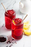 Lemon hibiscus tea served cold with ice photo