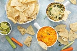 Artichoke spinach and buffalo chicken dips with chips photo