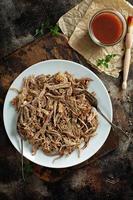 Pulled pork with forks on a plate photo