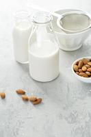 Almond milk in glass bottles photo