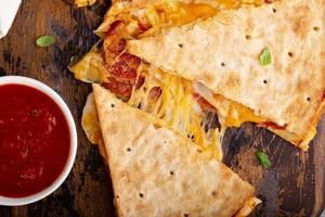 Pizza quesadilla with marinara sauce photo