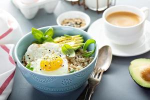 Savory oatmeal with egg and avocado photo