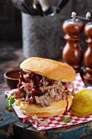 Pulled pork sandwich with pickles photo