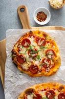 Flatbread pepperoni pizza with basil photo