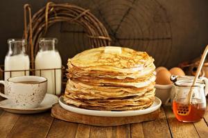 Stack of thin russian pancakes or crepes photo