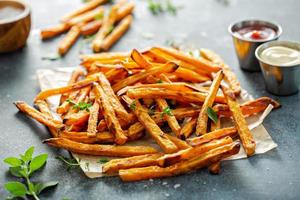 Sweet potato fries with sauces photo