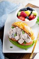 Croissant sandwich with potato salad photo